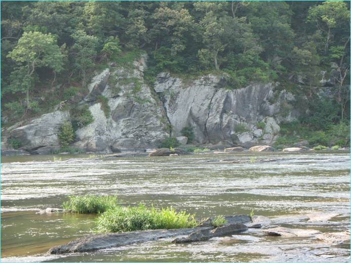 The River Wall. The 4 climbs on this wall are on the flat face near photo center. Jagged crack is the crack just right of center of the photograph.