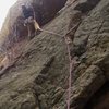 Micah S. ponders the crux roof on his first attempt at the N. Buttress (5.10+) of the Northwest Ridge of Dinosaur Mountain. Photo by Tony B, 11/12.