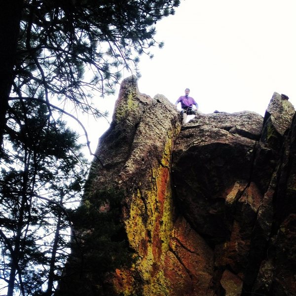 Tony B atop the roof on Idly I De-Ice (5.9) after the FA in Nov 2012. Pic by Micah S.