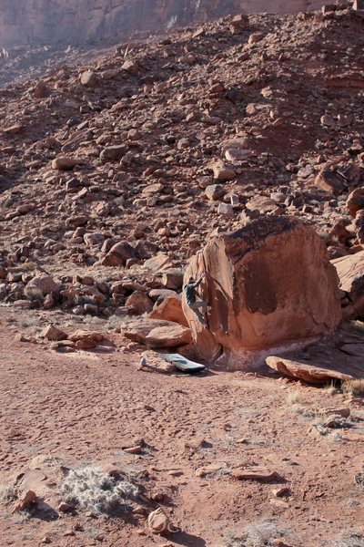 Christian Prellwitz climbing 'Split Decision' (v1+) at Big Bend in Moab, Utah.