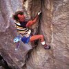 Todd Skinner on The Gunfighter (5.13), Hueco Tanks<br>
<br>
Photo by Paul Piana