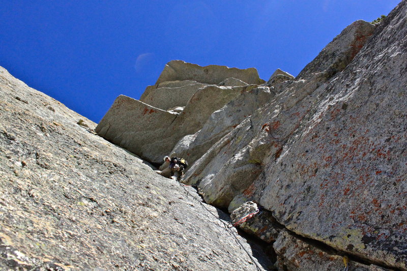 Randy below the roof traverse on P4