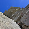 Randy below the roof traverse on P4