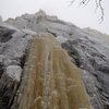 Climb ice to the ledge a short way up on the right.  Climb the crack off the ledge (in shallow, left-facing corner) and follow it to the top.