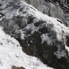 The first pitch traverse ledge goes from right to left in photo and is the iced rock climbing trail. Picture taken in woods above Approach Slab.