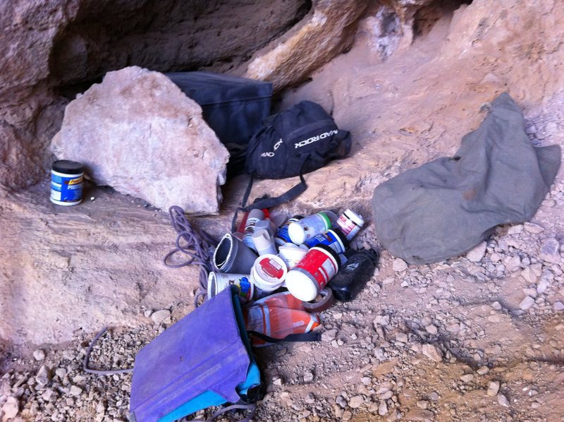 Trash left at the base of the cave.