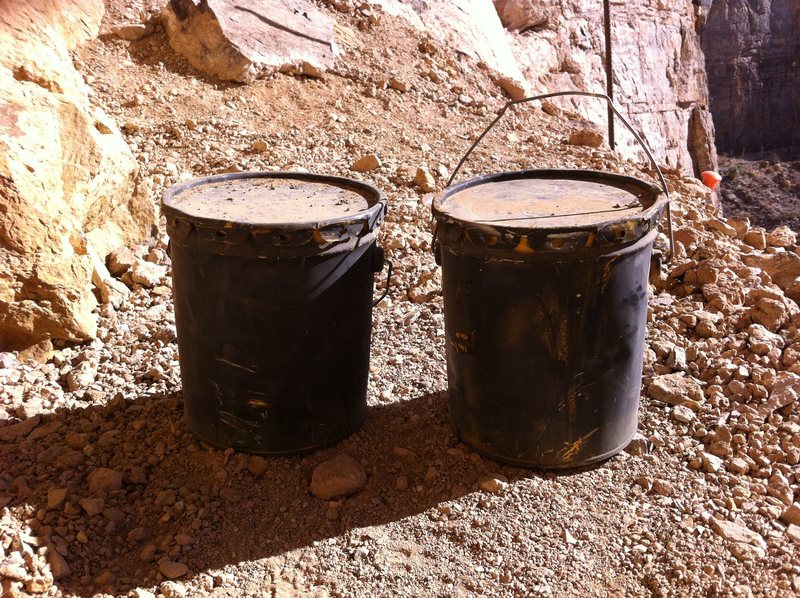 two buckets of glue left at the crag.