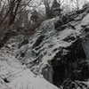 A photo of two ice tunnels off the left side of the crag.