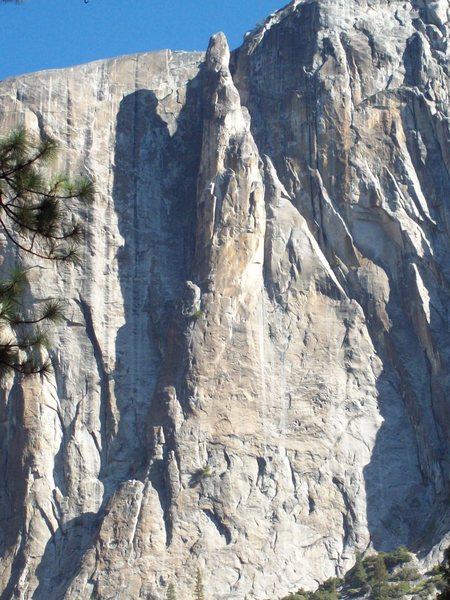 The Lost Arrow Spire.  The Chimney ascends the groove on the left in the shade.  Harding's direct route leapfrogs the ledges up the front. 