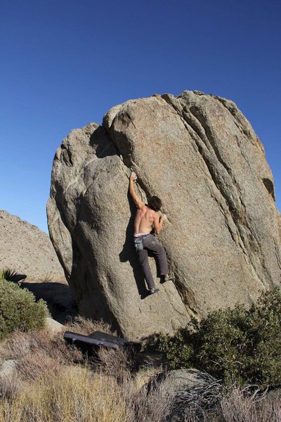 Not sure if this is rated or in the guidebook, but from the campground, you connect on this trail by the bathroom which will take you into a little valley as if you're walking to borrego springs. It's a lonesome boulder maybe a quarter mile walk. Can't miss it. More than one climb on the rock.