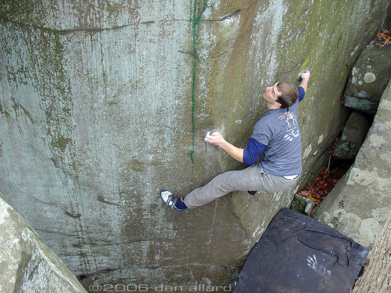 Drew intensly flagging on Nockamixion's classic highball arete, Iron Lion (V7). November 2006. danallardphoto.com