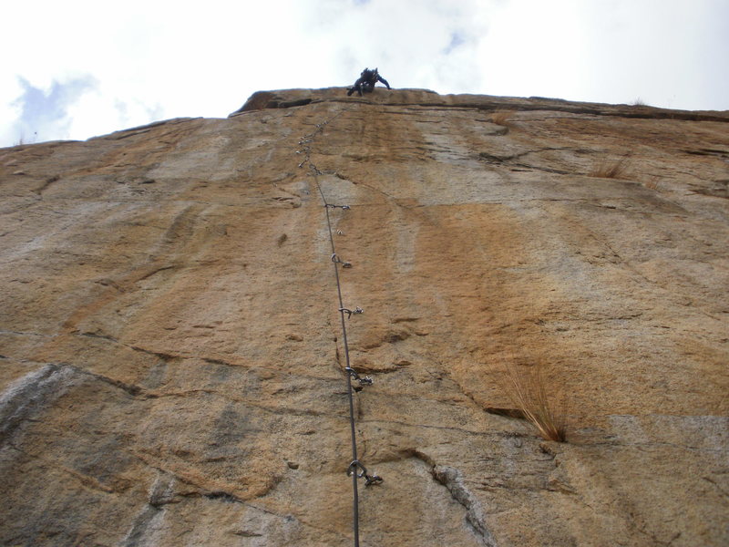 The crux of the Ladder is moving onto the 2 bolts just before the 2nd & final anchor. Nate's making the reachy move out right here to clip the bolts.