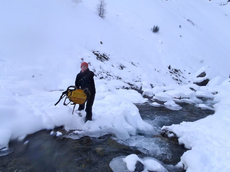 This should end well.... navigating stream crossing in ski boots