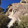 Context for the route.  The climb starts at the western end of Mean Mistreater Wall under the prominent roof.  The chains for the first belay are visible up and to the right from the roof.