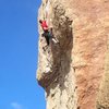 Mid-flight on the crux move.