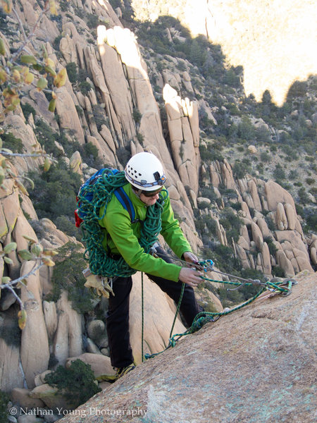 Rap station from the top.  You can make it all the way down with two ropes, no middle belay necessary.  <br>
<br>
If you are just a two person party, only take a single rope and do the two rap stations, much lighter and the rope management on a single with this route is way easier. 