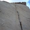 Looking up at the thin crack of Sweet Surprise. North face of The Loaf.