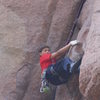 Laying back the 10a crux.