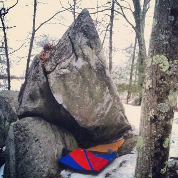 Start sitting as far under the boulder as possible follow the roof out and top out...V9?