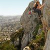 brett hanging on to the jug above the roof. lookin pretty casual at a massive slab whipper onto some hopefully solid gear