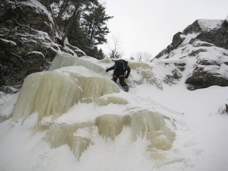 Scramblin' up an ice step.  Photo by Kevin Chlad