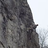 Tom on Peche Au Kiwi 7b, Pucelles, Roche de Freyr, Belgium.