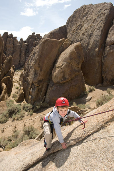 Bryson (5 years old in this photo) climbs Fiddlin' Buckaroo, in the Alabama Hills.