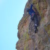 Final moves through the headwall, pitch 6  (photo by Stu Ritchie)