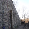 Shot of the main wall with the center outcropping.  Routes to the right of outcropping are more difficult.  Routes the left of outcropping are a little easier.  