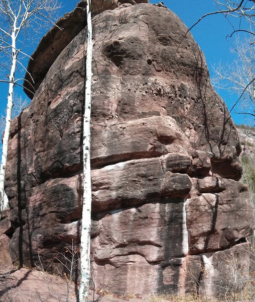 The seam is on the west face of the boulder.