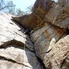 Guillaume Frechette on CC route. The screamer is clipped to the piton above the offwidth.