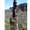 The approximate line of the existing climb, ending on the ledge with the chains that are also for "Drop 'em South". Yellow dot is the high bolt that enables finishing on Totem Pole.