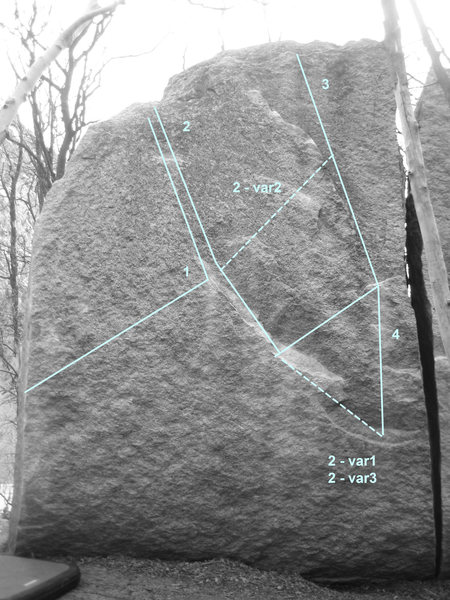 (1) Two Giant Steps V5/9.  Start pinching the arete with left and on a small sidepull with right.  One long reach to an edge at the top of the ramp for the right, followed by a long reach to a rail.<br>
(2) Mr Smiley V6.  Start on same holds as Smiley Right, but then follow the ramp up and left, finishing with a long move to a big, flat edge.<br>
*Variation 1:  V8.  Sit start.<br>
*Variation 2:  V5.  Exit right at the top of the ramp.<br>
*Variation 3:  V7:  Sit down and finish on variation 2.<br>
(3) Mr Smiley Right V4/5.  Start on the good edge with the left and the sloper with the right.  High step, and make a long move up and right.  Head straight up on jugs.  Using the offwidth to gain the initial jug is V3.  Sit start is V7.<br>
(4) Webb's Eliminate V10.  Start sitting, but avoid the ramp holds and head straight up on bad crimps immediately to the left of the offwidth until gaining the jug on Mr Smiley Right. 