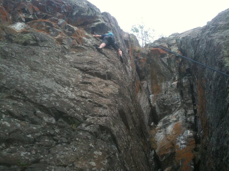 Directly below crux