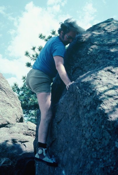 Rodger, finishing the [finishing the normal easy way of doing the one-arm mantel] route (V2-V3), 1983.