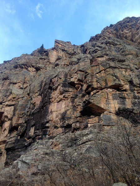 No Country For Old Men, 5.10+. Visible in this photo is the wide, wet crack of pitch one; stembox of pitch two; and the overhanging hand-crack of pitch three.