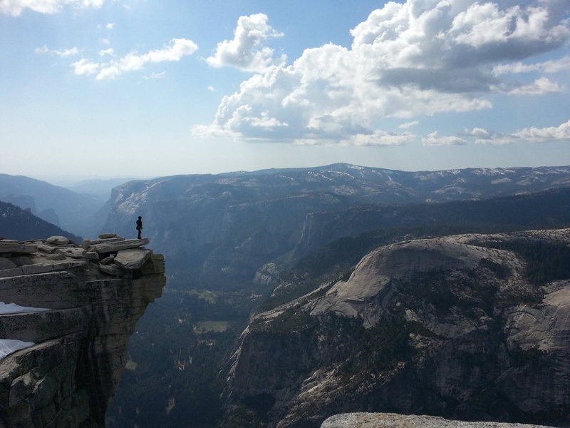 Adam standing on the "The Visor" at the Half Dome summit after climbing Snake Dike, April 24, 2013