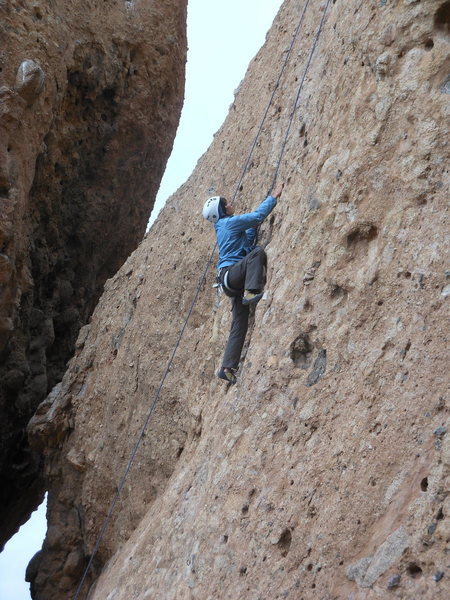 A climber enjoying the stellar pockets on "Sophie's Choice."