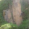 Alwyn, Captain Habesha, cleans some of the vines hanging over Hyena's Secret.