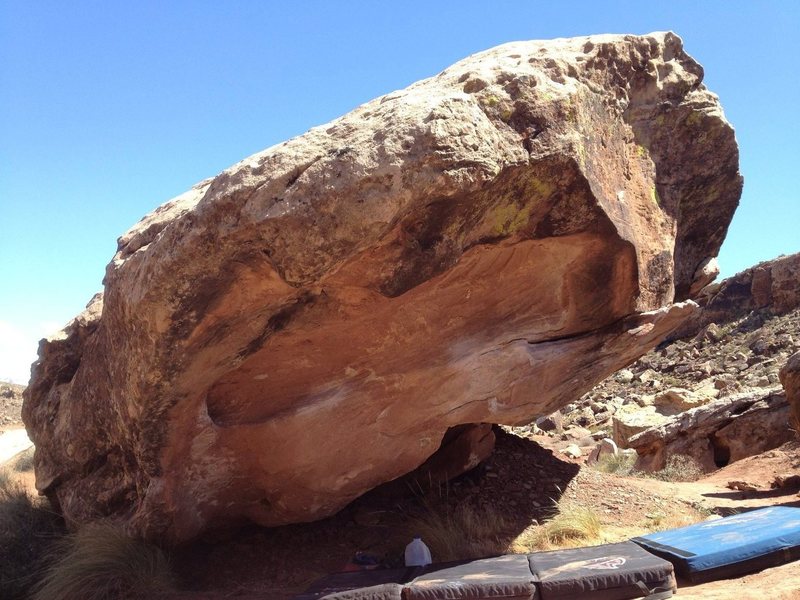 starting holds are on the left in this picture. you climb to the right and top out after you grab the big flake.