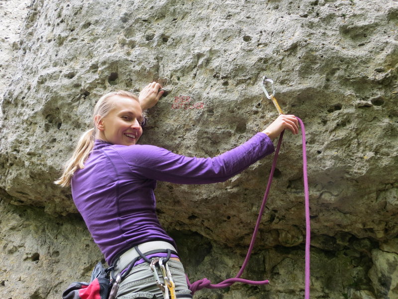 Fanny clipping the completely useless bolt at the beginning of the route. She's standing on solid ground.