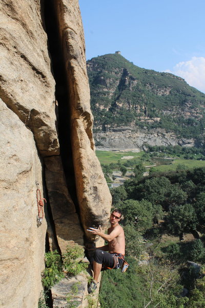 Marton Mihaltz on the "Flake of Fate." This giant piece of rock will probably stay put for the foreseeable future, given its size, but it seems to be pasted to the cliff by some act of God. Be careful and avoid it if you can. Marton found it awkward and cruxy anyways...
