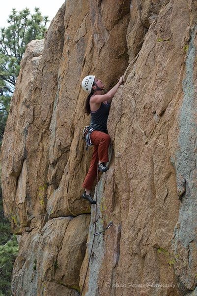 Joanne cruises through the runout section to the second bolt on Mighty Quinn 10c