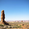 Robyn beating the heat on an early morning ascent of Owl Rock in Arches National Park - Utah