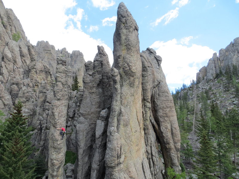 Bob Prann on Freak's Fright. Freak's Foot is the tall center spire with Flying Buttress right behind.