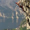 Climbing at the Belvedere crag near Nago, Italy with a great view of the northern end of Lake Garda and the town of Torbole sul Garda below. June 2013. 