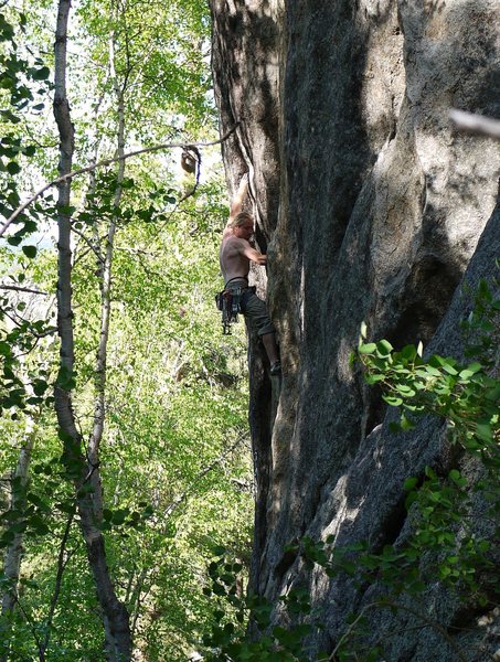 SteveZ sending Slang, a powerful 5.12- to the left of Evergreen on the smaller formation.  See the Busse guide.  