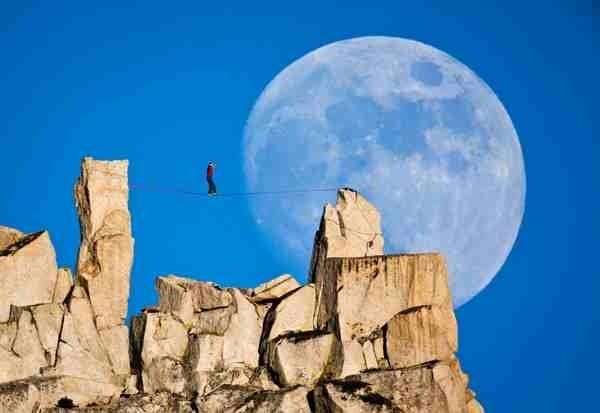 Dean Potter highline . Photo by Mikey Schaefer .