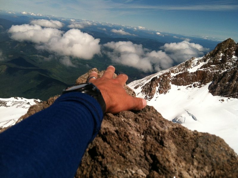 Reaching out to touch the highest point of the "teetering" summit block... sketch!