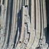 "Pitch 1(10a), fun and continuous with thin fingers & liebacking up the corner to a belay on top of the column on the left. Pitch 2 heads up a short corner (10a)to another ledge. These pitches could be combined with a 60m rope." Photo of us below pitch 3 (5.9) of Tulgey Wood